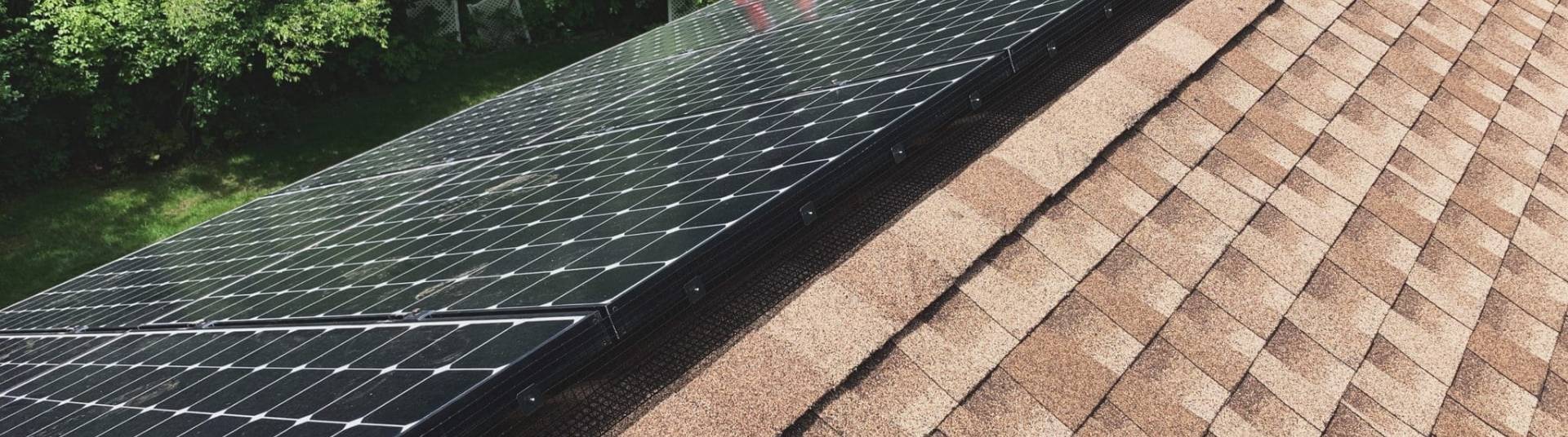 Rooftop view of critter guard over solar panel after installation