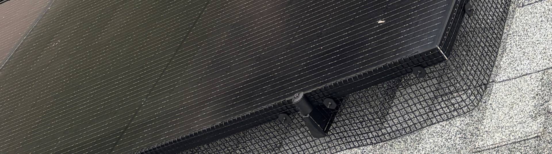 Critter guard close up of solar panel protected